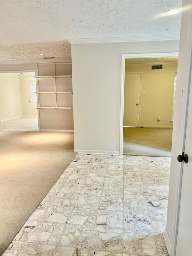 6523 Coral Ridge Rd, Houston, TX 77069 - hall with ornamental molding, carpet, baseboards, and a textured ceiling