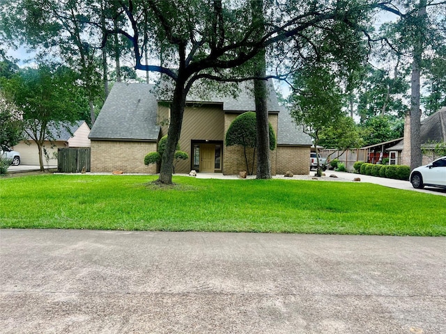 6523 Coral Ridge Rd, Houston, TX 77069 - mid-century modern home featuring a shingled roof and brick siding