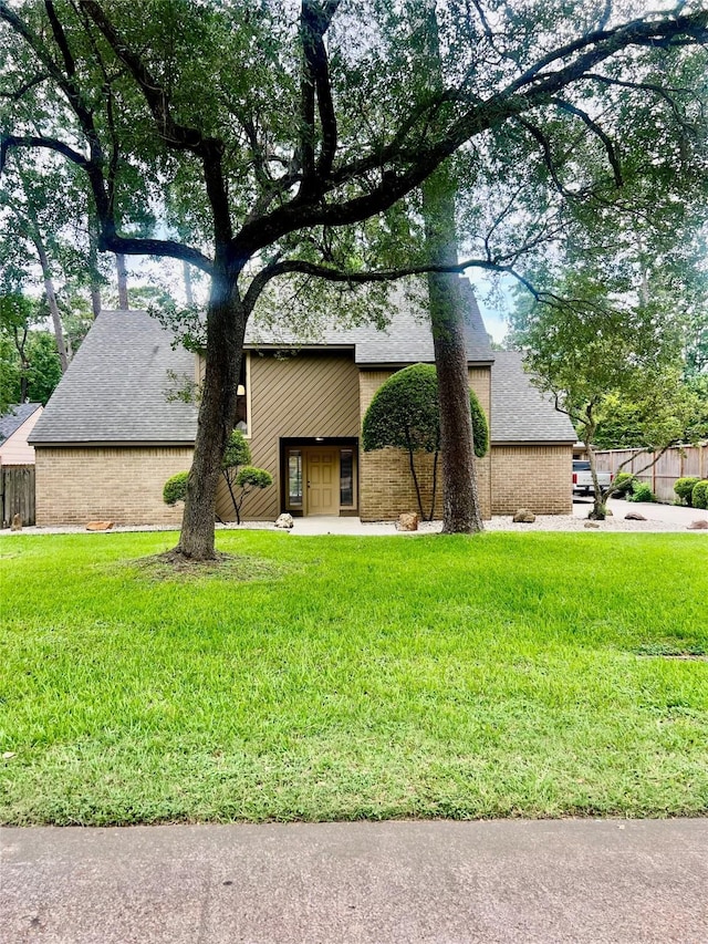 6523 Coral Ridge Rd, Houston, TX 77069 - view of front facade featuring a shingled roof and brick siding