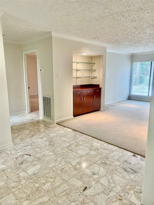 6523 Coral Ridge Rd, Houston, TX 77069 - unfurnished living room featuring crown molding, a textured ceiling, baseboards, and carpet