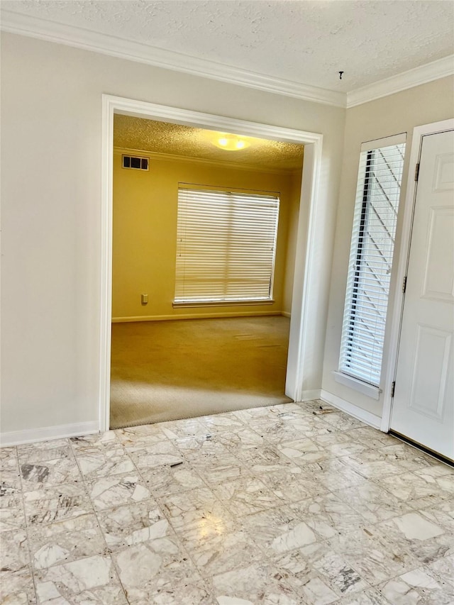 6523 Coral Ridge Rd, Houston, TX 77069 - unfurnished room featuring baseboards, ornamental molding, and a textured ceiling
