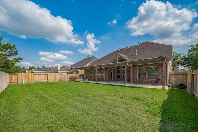 14727 Bronze Finch Dr, Cypress, TX 77433 - rear view of house with brick siding and a patio area