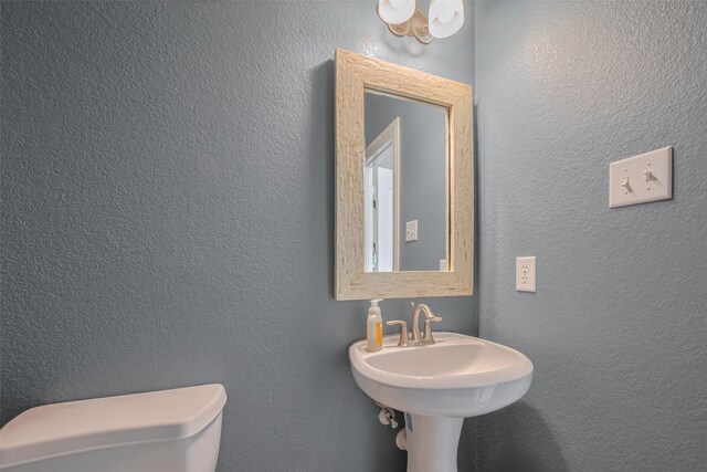 14727 Bronze Finch Dr, Cypress, TX 77433 - bathroom featuring toilet and a textured wall