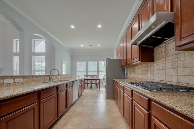 14727 Bronze Finch Dr, Cypress, TX 77433 - kitchen featuring a sink, stainless steel appliances, wall chimney range hood, ornamental molding, and tasteful backsplash