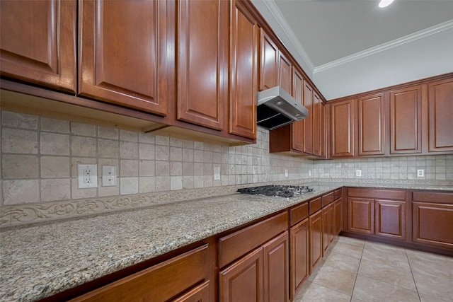 14727 Bronze Finch Dr, Cypress, TX 77433 - kitchen featuring crown molding, wall chimney exhaust hood, stainless steel gas stovetop, decorative backsplash, and light stone counters