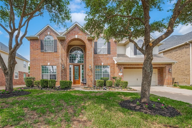 14727 Bronze Finch Dr, Cypress, TX 77433 - traditional-style home featuring driveway, brick siding, and a front lawn