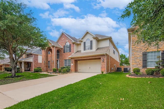 14727 Bronze Finch Dr, Cypress, TX 77433 - traditional-style house with central AC unit, brick siding, a garage, a front yard, and driveway