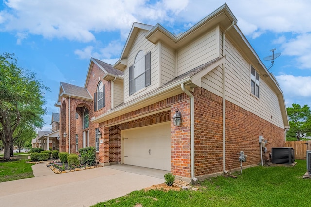 14727 Bronze Finch Dr, Cypress, TX 77433 - view of side of home featuring an attached garage, brick siding, central AC, and driveway