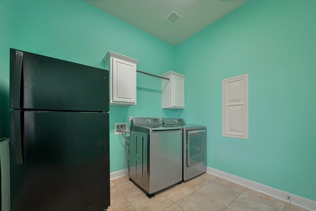 14727 Bronze Finch Dr, Cypress, TX 77433 - laundry area featuring washer and clothes dryer, cabinet space, baseboards, and light tile patterned floors