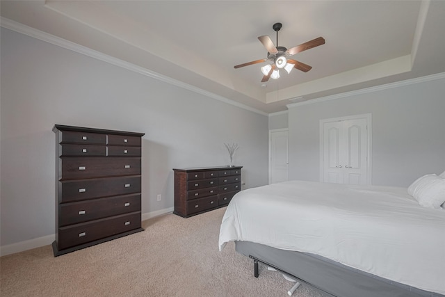 14727 Bronze Finch Dr, Cypress, TX 77433 - bedroom with a tray ceiling, light carpet, ornamental molding, baseboards, and a ceiling fan