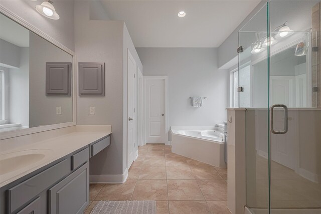 14727 Bronze Finch Dr, Cypress, TX 77433 - full bathroom featuring vanity, a garden tub, a stall shower, and baseboards