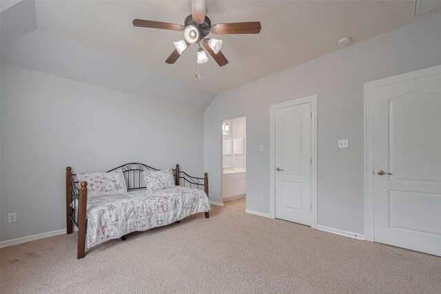 14727 Bronze Finch Dr, Cypress, TX 77433 - bedroom featuring light carpet, lofted ceiling, baseboards, ensuite bathroom, and a ceiling fan