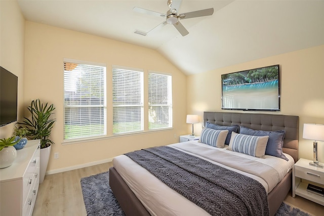 15111 Crescent Lilly Dr, Cypress, TX 77433 - bedroom featuring light wood-style floors, lofted ceiling, baseboards, and ceiling fan