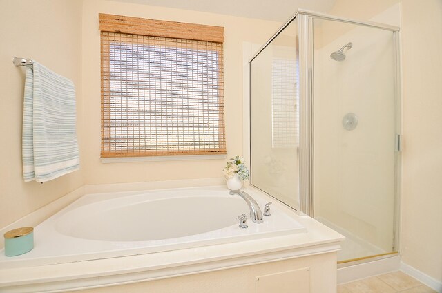 15111 Crescent Lilly Dr, Cypress, TX 77433 - bathroom featuring a shower stall, a garden tub, and tile patterned floors