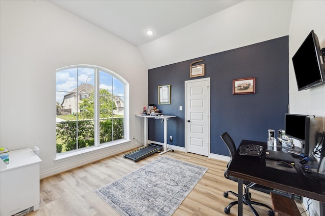 1810 Opal Field Ln, Richmond, TX 77469 - office area featuring light wood-style floors, baseboards, an accent wall, and high vaulted ceiling