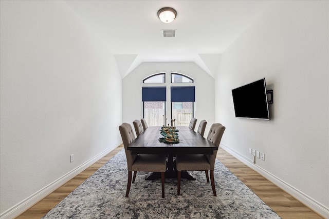 1810 Opal Field Ln, Richmond, TX 77469 - dining room with light wood-style floors, baseboards, and vaulted ceiling