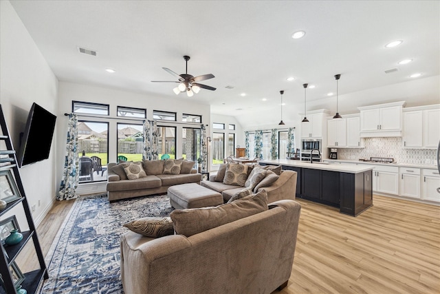 1810 Opal Field Ln, Richmond, TX 77469 - living area with light wood-style flooring, ceiling fan, and recessed lighting