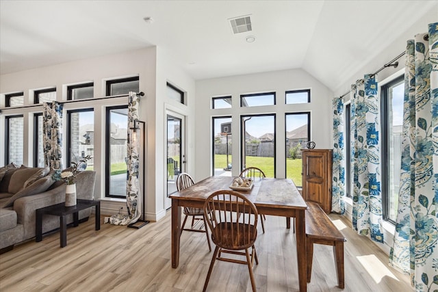 1810 Opal Field Ln, Richmond, TX 77469 - dining area with healthy amount of natural light, light wood-style flooring, vaulted ceiling, and baseboards