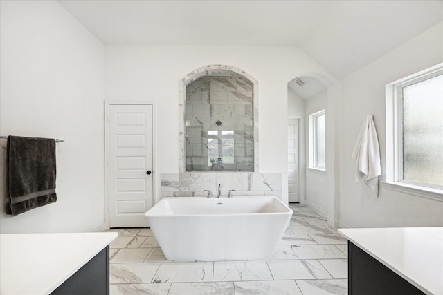 1810 Opal Field Ln, Richmond, TX 77469 - full bathroom featuring marble finish floors, a freestanding bath, a stall shower, lofted ceiling, and vanity