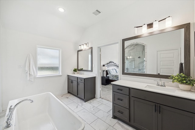 1810 Opal Field Ln, Richmond, TX 77469 - ensuite bathroom featuring marble finish flooring, two vanities, a freestanding bath, a stall shower, and lofted ceiling