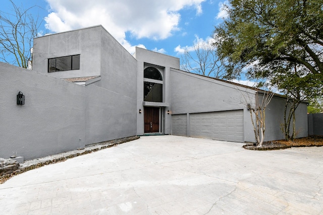 8115 Fondren Lake Dr, Houston, TX 77071 - view of front of house with a garage, concrete driveway, and stucco siding