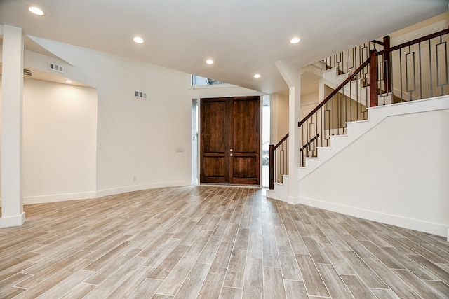 8115 Fondren Lake Dr, Houston, TX 77071 - foyer entrance featuring light wood-style flooring, stairs, baseboards, and recessed lighting