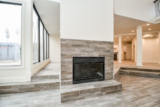8115 Fondren Lake Dr, Houston, TX 77071 - detailed view of a tile fireplace, baseboards, recessed lighting, and wood finished floors