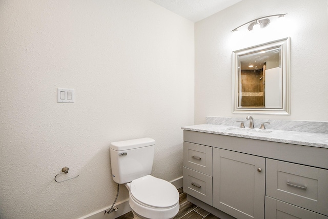 8115 Fondren Lake Dr, Houston, TX 77071 - bathroom featuring vanity, wood finished floors, toilet, and baseboards