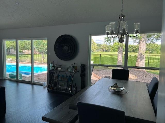 3311 Oyster Cove Dr, Missouri City, TX 77459 - dining room with a chandelier and wood finished floors
