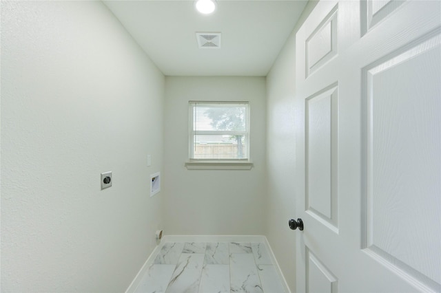5978 Southmont St, Houston, TX 77033 - laundry room with electric dryer hookup, baseboards, marble finish flooring, and hookup for a washing machine