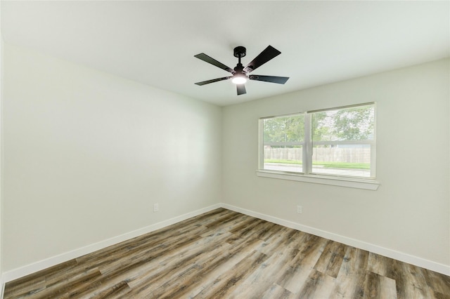5978 Southmont St, Houston, TX 77033 - unfurnished room featuring baseboards, wood finished floors, and ceiling fan
