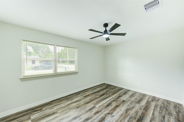 5978 Southmont St, Houston, TX 77033 - empty room featuring wood finished floors, baseboards, and ceiling fan