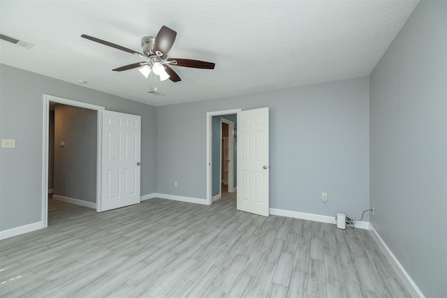 15923 Pine Mountain Dr, Houston, TX 77084 - unfurnished bedroom with baseboards, light wood-style floors, and a ceiling fan