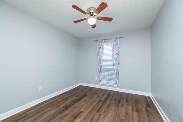 15923 Pine Mountain Dr, Houston, TX 77084 - spare room with dark wood-style floors, baseboards, and a ceiling fan