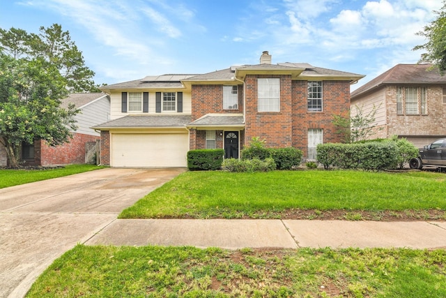 21406 Park Post Ln, Katy, TX 77450 - traditional-style house featuring brick siding, solar panels, driveway, a chimney, and a front lawn