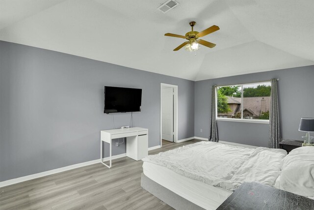 21406 Park Post Ln, Katy, TX 77450 - bedroom featuring wood finished floors, vaulted ceiling, baseboards, and ceiling fan