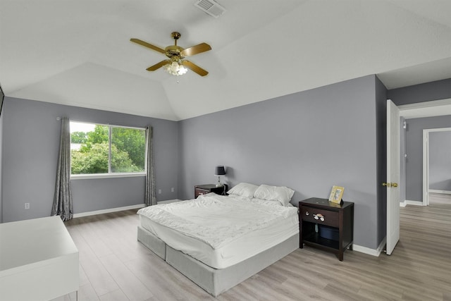 21406 Park Post Ln, Katy, TX 77450 - bedroom featuring wood finished floors, vaulted ceiling, baseboards, and a ceiling fan