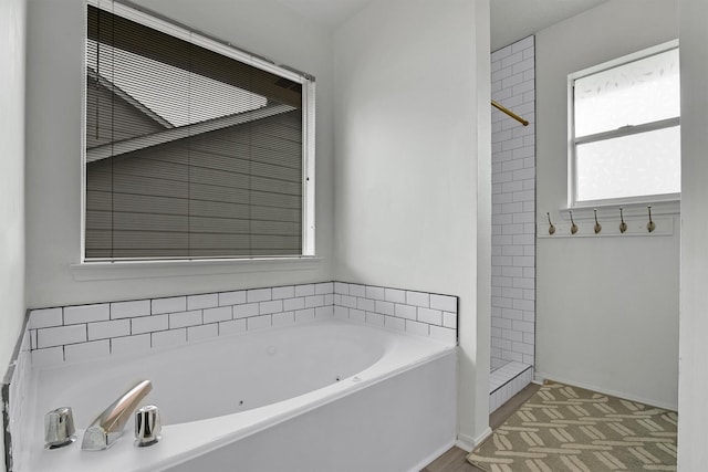 21406 Park Post Ln, Katy, TX 77450 - bathroom with a whirlpool tub and a tile shower