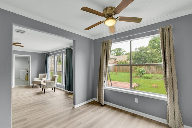 21406 Park Post Ln, Katy, TX 77450 - sitting room with a ceiling fan, crown molding, baseboards, and light wood finished floors