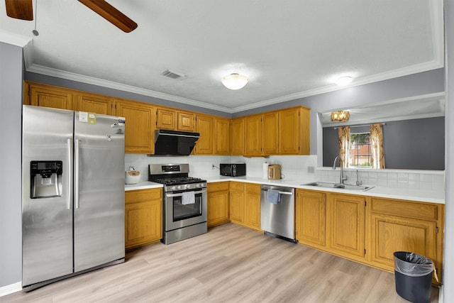 21406 Park Post Ln, Katy, TX 77450 - kitchen featuring stainless steel appliances, a sink, light countertops, ceiling fan, and backsplash