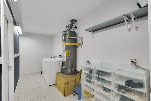 21406 Park Post Ln, Katy, TX 77450 - laundry room with separate washer and dryer, strapped water heater, and light tile patterned floors