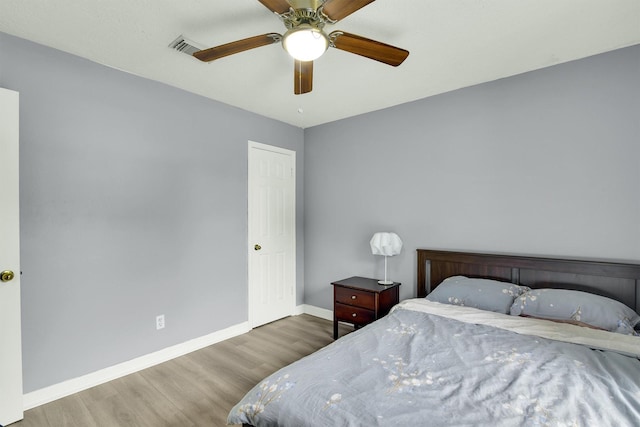 21406 Park Post Ln, Katy, TX 77450 - bedroom with wood finished floors, baseboards, and ceiling fan