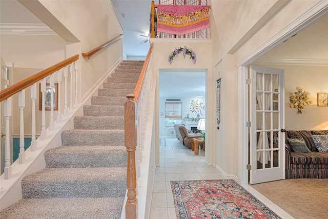 4406 Plantation Creek Dr, Missouri City, TX 77459 - stairs with ornamental molding, tile patterned flooring, and a high ceiling