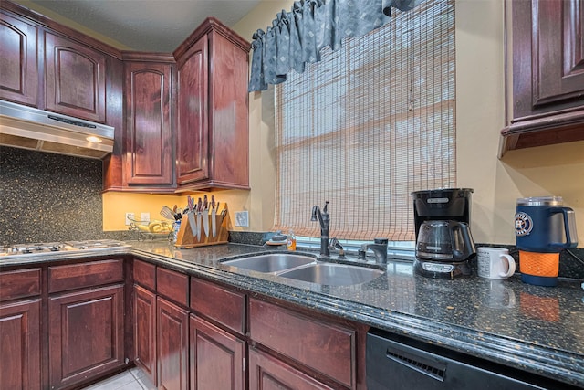4406 Plantation Creek Dr, Missouri City, TX 77459 - kitchen with a sink, black dishwasher, under cabinet range hood, dark stone countertops, and reddish brown cabinets