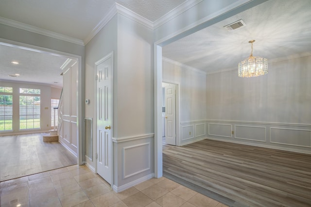 4226 Roaring Rapids Dr, Houston, TX 77059 - unfurnished dining area with tile patterned flooring, a decorative wall, a chandelier, ornamental molding, and wainscoting