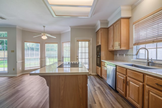 4226 Roaring Rapids Dr, Houston, TX 77059 - kitchen featuring black appliances, a sink, dark wood-style floors, light countertops, and a kitchen island