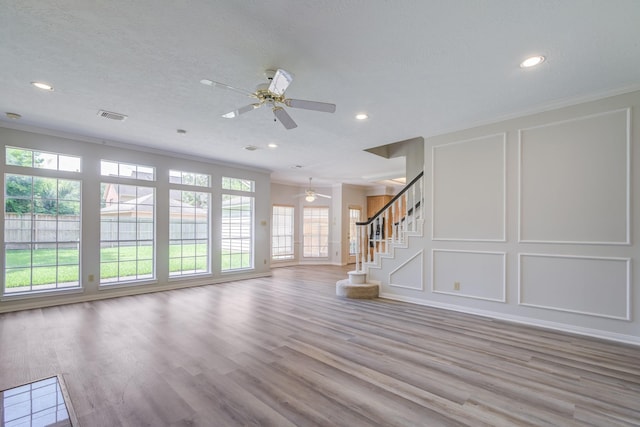 4226 Roaring Rapids Dr, Houston, TX 77059 - unfurnished living room featuring ceiling fan, ornamental molding, recessed lighting, stairs, and wood finished floors