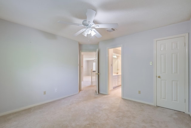 4226 Roaring Rapids Dr, Houston, TX 77059 - unfurnished bedroom with light carpet, baseboards, ensuite bath, and a ceiling fan