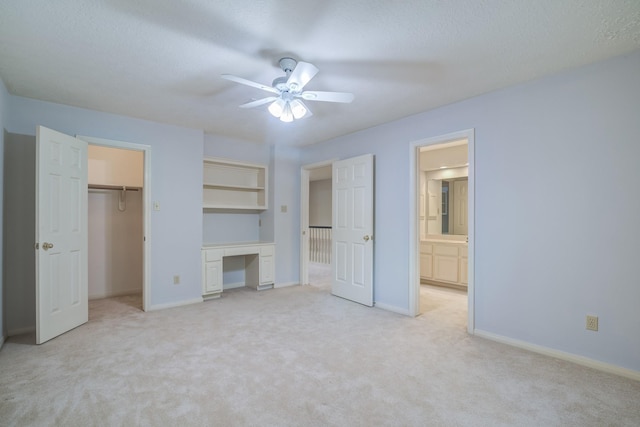 4226 Roaring Rapids Dr, Houston, TX 77059 - unfurnished bedroom featuring light colored carpet, baseboards, a desk, connected bathroom, and a ceiling fan