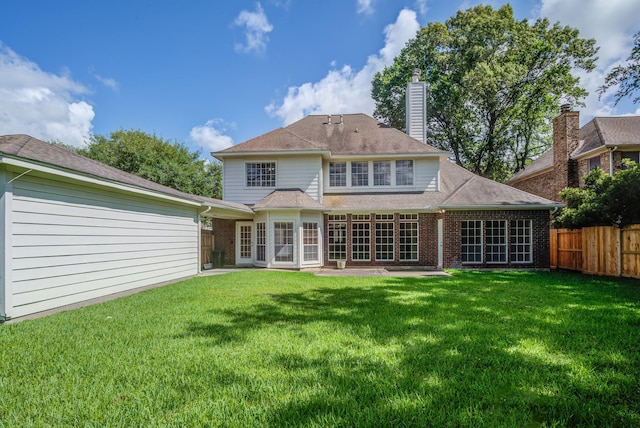 4226 Roaring Rapids Dr, Houston, TX 77059 - rear view of property with brick siding and a chimney